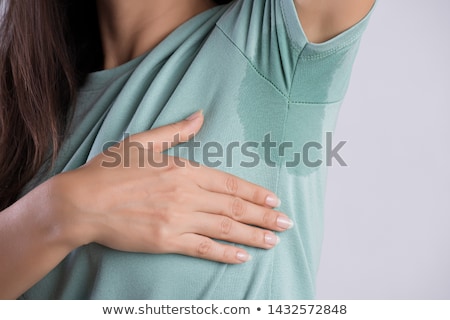 [[stock_photo]]: Close Up Of A Woman With Sweaty Armpit