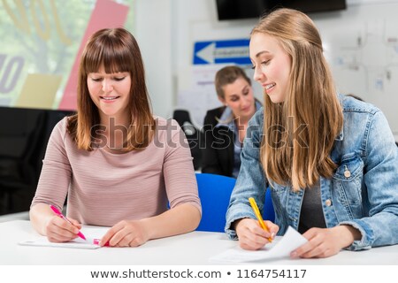 Students Writing Test Or Exam After Finishing Their Driving Lessons Foto stock © Kzenon