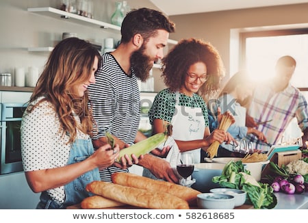 Stock photo: Happy Friends And Chef Cook Cooking In Kitchen