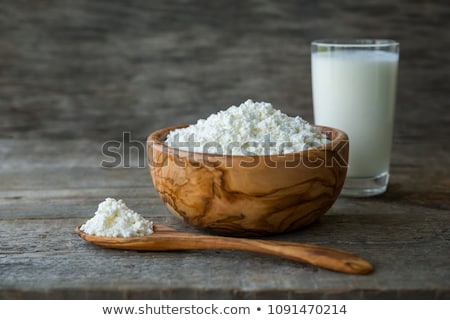 Foto d'archivio: Fresh Dairy Products On White Table Background Glass Of Milk Bowl Of Sour Cream And Cottage Cheese