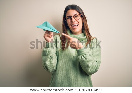 Zdjęcia stock: Excited Happy Young Woman Isolated Over Grey Background Showing Hopeful Gesture