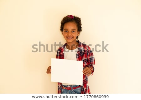 Zdjęcia stock: Casual Young Girl Smiling With A Blank Sheet