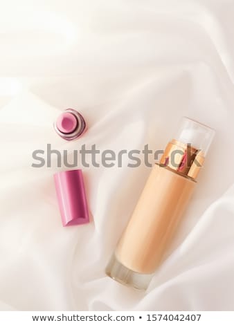 Stockfoto: Beige Tonal Cream Bottle Make Up Fluid Foundation Base And Pink