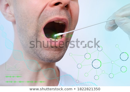 ストックフォト: Close Up Of A Doctor Taking Saliva Sample For Dna Test