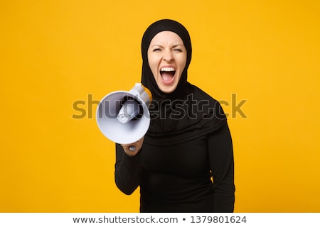 Stok fotoğraf: Young Woman Shouting In Megaphone Technology Announcement Concept