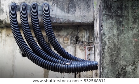 Zdjęcia stock: Electrical Coil Conduit Pipe On Box Embedded In Wall