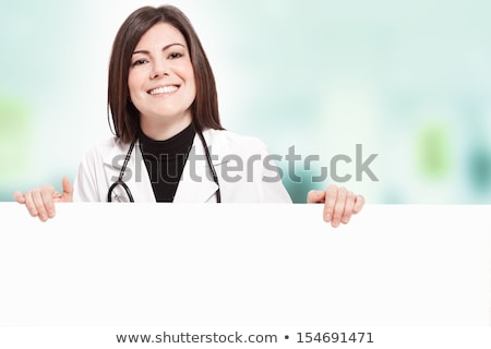 Female Doctor Holding A Blank Card Stok fotoğraf © Francesco83