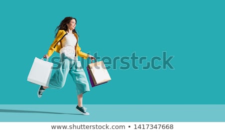 Foto stock: Young Happy Woman With Shopping Bags