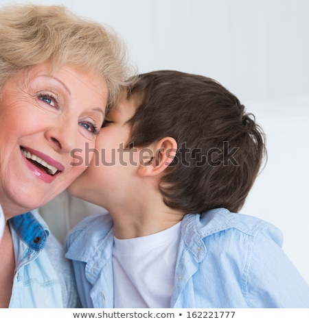 Stock photo: Grandmother With Grandson Having Fun At Home - Whispering Secret