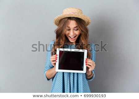 Stock photo: Happy Girl Showing On Tablet