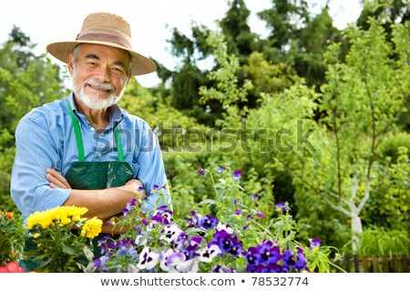 Stok fotoğraf: Happy Attractive Man In The Garden