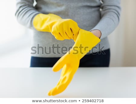 Stok fotoğraf: Close Up Of Woman Wearing Protective Rubber Gloves