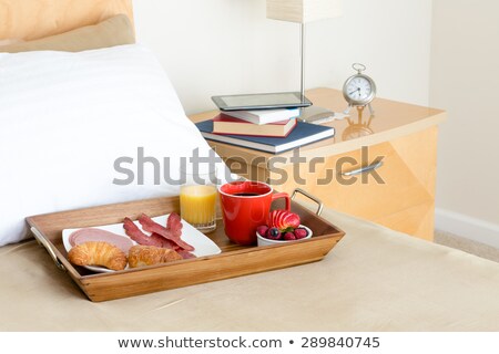 Stockfoto: Breakfast In Bed Tray On Bed Beside Night Stand