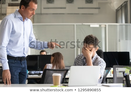 Stockfoto: Boss Hand Firing Guilty Businessman