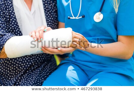 Woman With Broken Arm Orthopedist Foto stock © Barabasa