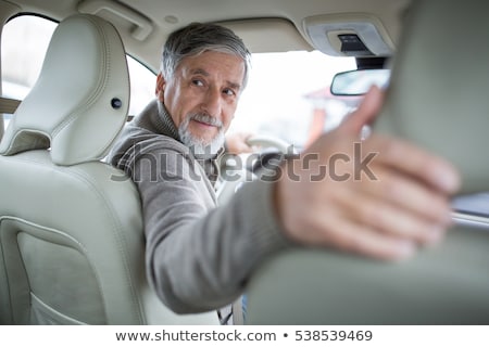 Сток-фото: Senior Drive Driving His Modern Car Going In Reverse