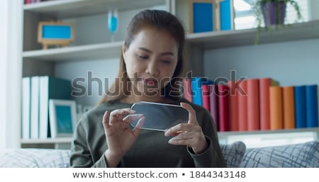 Foto stock: Womans Hand Using Invisible Screen