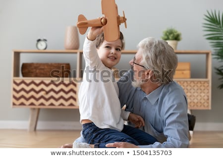 Foto stock: Grandfather Playing With Boy