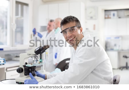 Stok fotoğraf: Scientist Working With Chemicals In Laboratory