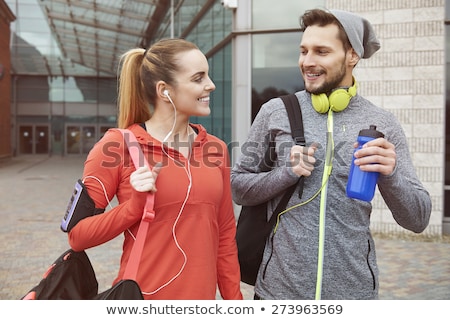 Foto stock: Smiling Young Sport Couple Talking