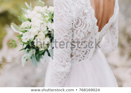 Stockfoto: Bride Holds A Wedding Bouquet Wedding Dress Wedding Details