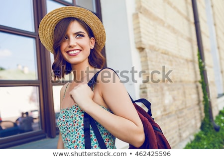 Zdjęcia stock: Portrait Of Pretty Cheerful Woman Wearing White Dress And Straw