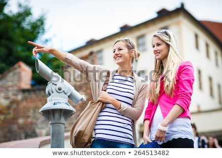 Stock fotó: Two Pretty Young Women Sightseeing In Prague Historic Center