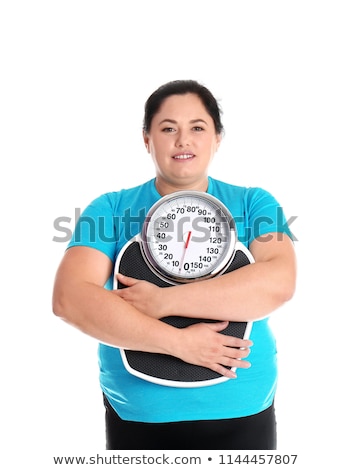 ストックフォト: Women With Overweight On Scales In Gym