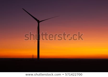 Foto stock: Windfarm At Sunset And Sky With Dust From Volcano