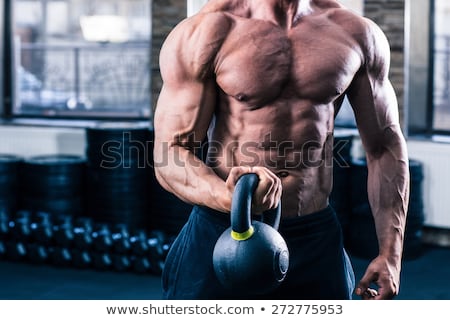 [[stock_photo]]: Closeup Image Of A Man Doicing Exercise With Kette Ball