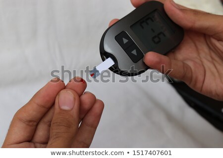 Stock fotó: Doctor Measuring Sugar Reading Of Patient