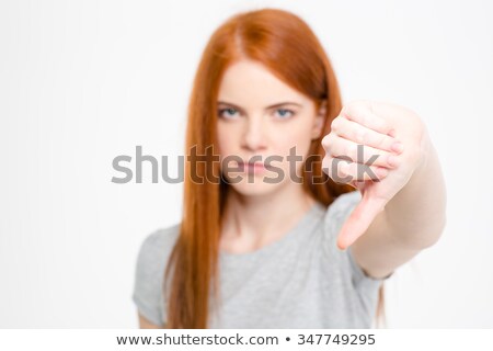 Stok fotoğraf: Angry Frustrated Young Redhear Female Showing Thumbs Down