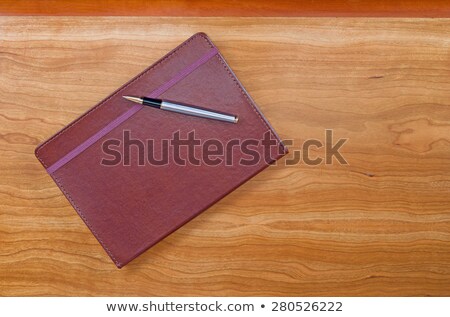Leather Notepad With Pen On Cherry Wood Desktop ストックフォト © tab62