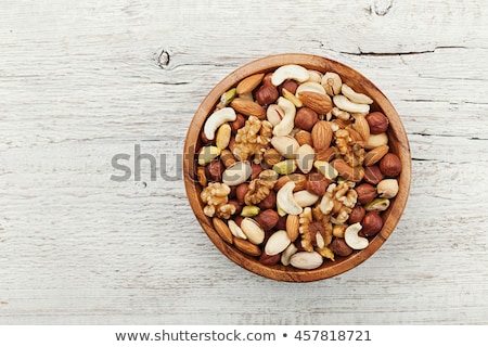 Zdjęcia stock: Pistachio Nuts On Wooden Background Top View