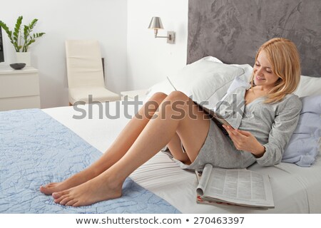 Stock fotó: Woman In Robe Laying On Cushions