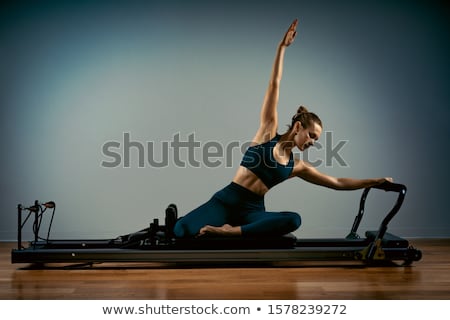 Stock fotó: Gym Woman Pilates Stretching Sport In Reformer Bed