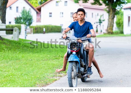 Zdjęcia stock: Brother And Sister Enjoying Ride On Motorbike