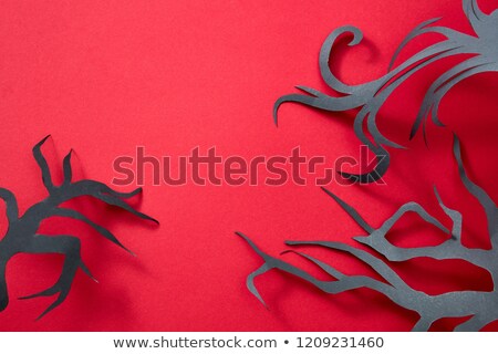 Halloween Composition Of Paper Handcraft Branches Of Trees On A Red Background With Space For Text Сток-фото © artjazz