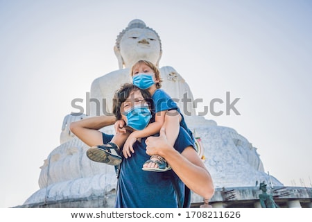 Foto d'archivio: Father And Son Tourists On The Big Buddha Statue Was Built On A High Hilltop Of Phuket Thailand Can