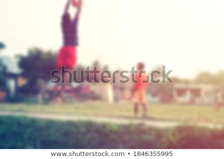 Foto d'archivio: Young Goalkeeper Saves Football Horizontal Background Junior Soccer Goalkeeper Saving On A Goal