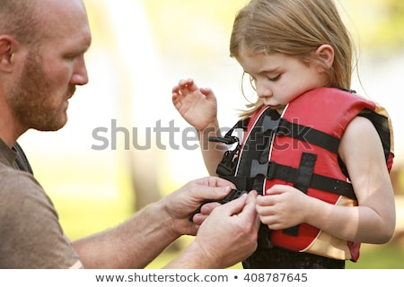 Stock foto: Child With Safety Vest On The Lake Boat