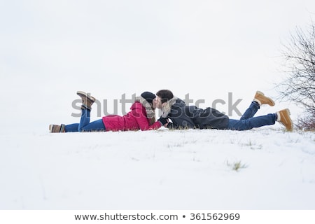 Сток-фото: Two Teenagers Havinf Fun On The Snow Field