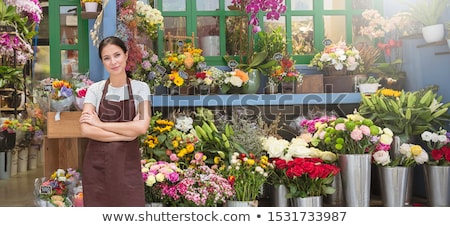[[stock_photo]]: Young Woman Working As Florist In Flower Shop