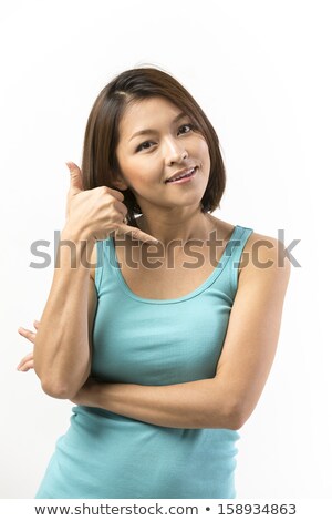 Foto d'archivio: Cute Young Asian Woman Making A Call Me Gesture
