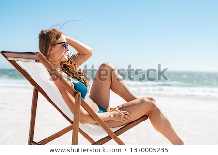 Foto stock: Red Haired Woman Wearing Bikini