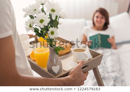 Stock photo: Attractive Young Woman Lying On Her Bed