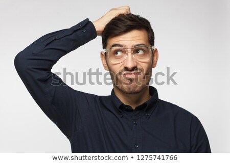 Stockfoto: Businessman Scratching His Head In Doubt
