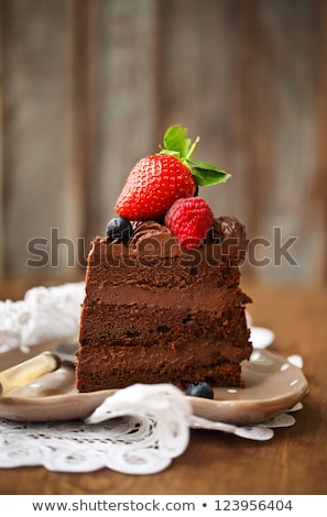 Zdjęcia stock: Piece Of Chocolate Cake On A Plate With A Spoon And Black Coffee