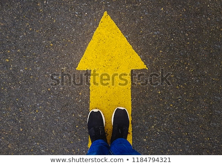 Foto stock: White Arrow On Asphalt Road Traffic Sign
