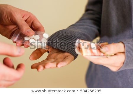 Stok fotoğraf: Close Up Of Addict Or Drug Dealer Hands With Money